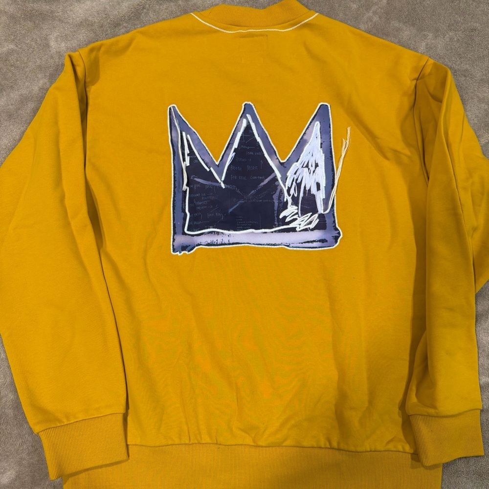 Yellow Sweatshirt with Blue Crown Graphic